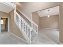 Clean staircase with a neutral color scheme and a view into a living area at 3404 Shady Brook Ln, Sarasota, FL 34243