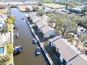 Aerial view of waterfront condos, showing their location along a canal at 355 Moorings Cove Dr # 355, Tarpon Springs, FL 34689