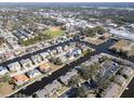 Wide aerial view showing the property's location near a waterway at 355 Moorings Cove Dr # 355, Tarpon Springs, FL 34689