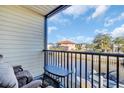 Balcony overlooking a canal, featuring outdoor furniture and a view of the water at 355 Moorings Cove Dr # 355, Tarpon Springs, FL 34689