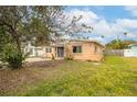 Light peach single story house with a small front yard at 4000 Huntington Ne St, St Petersburg, FL 33703