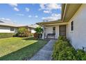 Front entrance with a bench and lush landscaping at 4329 Dresden Ln # 20, Sarasota, FL 34233