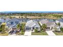 Community overview showcasing houses, lake, and park at 5629 Maidenstone Way, Palmetto, FL 34221