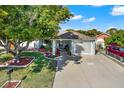 House with landscaped yard and driveway, aerial perspective at 9445 Barnstead Ln, Port Richey, FL 34668