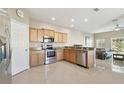 Modern kitchen with stainless steel appliances and granite countertops at 1115 Andrew Aviles Cir, Tampa, FL 33619