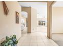 Bright foyer with view into living areas and kitchen at 1330 Misty Greens Dr, Sun City Center, FL 33573