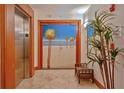 Condo building lobby with elevator and beach mural at 1350 Gulf Blvd # 604, Clearwater, FL 33767