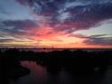 Stunning sunset over the water with pink and orange clouds at 1365 Snell Isle Ne Blvd # 6A, St Petersburg, FL 33704