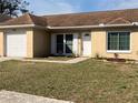 One-story house with a brown roof, attached garage, and manicured lawn at 1915 Crown Park Dr, Valrico, FL 33594