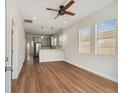 Bright living room features hardwood floors, an open concept layout, and a modern kitchen at 2515 N Howard Ave, Tampa, FL 33607