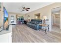 Living room with hardwood floors and a home office area at 2533 Duncan Dr, Belleair Bluffs, FL 33770