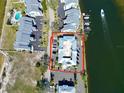 Aerial view of waterfront condo complex with ample parking and boat docks at 611 Destiny Dr # 410, Ruskin, FL 33570