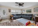 Living room with hardwood floors and a large sectional sofa at 651 Southwest N Blvd, St Petersburg, FL 33703