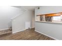 Dining area with kitchen pass-through and wood-look floors at 7124 Waterside Dr # 7124, Tampa, FL 33617