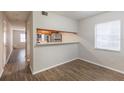 Dining area with kitchen pass-through and wood-look floors at 7124 Waterside Dr # 7124, Tampa, FL 33617
