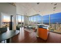 Open-concept living room with city views and hardwood floors at 777 N Ashley Dr # 2503, Tampa, FL 33602