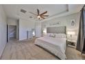 Spacious main bedroom with a king-size bed and neutral decor at 9608 Ivory Dr, Ruskin, FL 33573