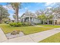 Craftsman home with lush landscaping and walkway at 1012 River Heights Ave, Tampa, FL 33603