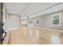 Light-filled living room with hardwood floors and open floor plan at 1012 River Heights Ave, Tampa, FL 33603