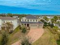 Two-story house with a large driveway and nicely landscaped yard at 11550 Lake Lucaya Dr, Riverview, FL 33579