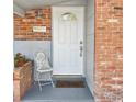 Inviting front entrance with white door and brick accents at 1159 Stewart Dr, Dunedin, FL 34698