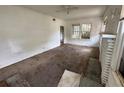 Bright living room with large windows and ceiling fan at 1311 11Th S Ave, St Petersburg, FL 33705