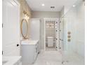 Elegant bathroom with a walk-in shower, freestanding tub, and modern fixtures at 17311 Gunn Hwy, Odessa, FL 33556