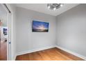 Simple bedroom with hardwood floors and large TV at 175 1St S St # 211, St Petersburg, FL 33701