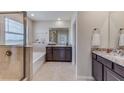 Primary bathroom with soaking tub, double vanity, and a walk-in shower at 17916 Tavernside Trl, Lakewood Ranch, FL 34211