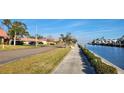 Waterfront community with paved pathways and tropical landscaping at 19029 Us Highway 19 N # 23C, Clearwater, FL 33764