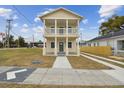 Two-story house with a front porch and driveway at 2204 E 12Th Ave, Tampa, FL 33605