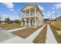 Two-story house with a front porch and driveway at 2204 E 12Th Ave, Tampa, FL 33605