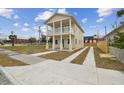 Two-story house with a front porch and driveway at 2204 E 12Th Ave, Tampa, FL 33605