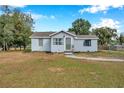 Newly renovated home with a green door and spacious yard at 2606 S Wilder Loop, Plant City, FL 33565