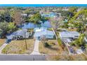 Aerial view showcasing a waterfront home and neighborhood at 404 Manor Blvd, Palm Harbor, FL 34683