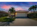 Charming one-story home with tile roof, two-car garage, and well-manicured lawn at 4415 Muirfield, Bradenton, FL 34210