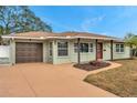 Newly renovated home with a large driveway and landscaping at 5425 36Th N Ave, St Petersburg, FL 33710