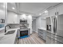 Renovated kitchen featuring gray and white cabinets and a breakfast bar at 5425 36Th N Ave, St Petersburg, FL 33710