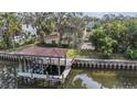 Private boat lift and dock with covered seating area at 660 Geneva Pl, Tampa, FL 33606