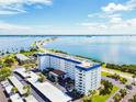 Aerial view of a waterfront building showcasing its location and parking at 7 Elgin Pl # 512, Dunedin, FL 34698