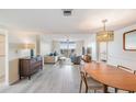 Bright living room with hardwood floors and water views at 7 Elgin Pl # 512, Dunedin, FL 34698