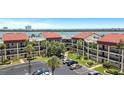 Condo building showcasing waterfront views and parking at 868 Bayway Blvd # 312, Clearwater Beach, FL 33767