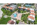 Complex with pool, tennis court, and lush landscaping at 868 Bayway Blvd # 312, Clearwater Beach, FL 33767