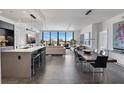 Open concept kitchen and living area with modern finishes and city views at 100 1St N Ave # 503, St Petersburg, FL 33701