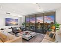 Modern living room featuring large windows and city views at 100 1St N Ave # 503, St Petersburg, FL 33701