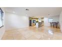 Bright living room features a granite island kitchen and tile floors at 1130 Queen N St, St Petersburg, FL 33713