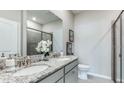 Bathroom boasts double vanity and a walk-in shower at 18133 Cropside Trl, Lakewood Ranch, FL 34211