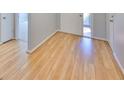 Light and bright entry hall with wood-look laminate flooring at 2421 Lancaster Dr, Sun City Center, FL 33573