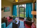 Relaxing screened porch with seating area, perfect for enjoying the outdoors at 314 Bluewater Falls Ct, Apollo Beach, FL 33572