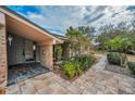 House entrance with stone patio and walkway at 3201 Belmore Rd, Tampa, FL 33618